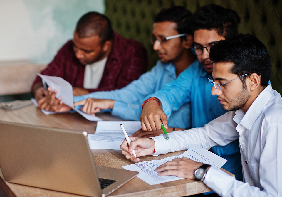 Group of people working on a business plan in an office